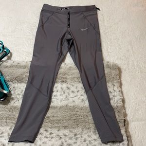 Never worn- Dark gray Nike workout pants women’s size medium-